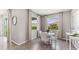 Breakfast nook with a round table and chairs, overlooking the backyard at 1011 159Th E Way, Bradenton, FL 34212