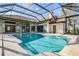 Enclosed, rectangular swimming pool with a large screened patio at 1306 Forestedge Blvd, Oldsmar, FL 34677