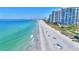 Aerial of beach, ocean, and high rise condos at 1582 Gulf Blvd # 1208, Clearwater, FL 33767