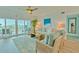 Spacious living room with ocean views, hardwood floors, and coastal decor at 1582 Gulf Blvd # 1208, Clearwater, FL 33767