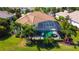 Aerial view of the house, pool, and surrounding landscape at 15908 Castle Park Ter, Lakewood Ranch, FL 34202