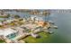 Aerial view of waterfront home with private dock and solar panels at 16111 5Th E St, Redington Beach, FL 33708