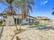 Spacious patio with pool and tropical landscaping at 16111 5Th E St, Redington Beach, FL 33708