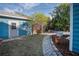 Landscaped backyard with stone path and shed at 165 21St Ne Ave, St Petersburg, FL 33704