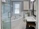 Bright bathroom features a soaking tub, tiled floors, and a vanity with a vessel sink at 165 21St Ne Ave, St Petersburg, FL 33704