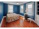 Bright bedroom with hardwood floors, desk, and plenty of natural light from multiple windows at 165 21St Ne Ave, St Petersburg, FL 33704