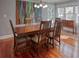 Formal dining room featuring a wooden dining table and chairs, hardwood floors, and ample natural light at 165 21St Ne Ave, St Petersburg, FL 33704