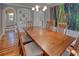 Spacious dining room featuring hardwood floors, a large painting, and built-in shelving at 165 21St Ne Ave, St Petersburg, FL 33704