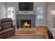 Gray brick fireplace with a warm, inviting fire at 165 21St Ne Ave, St Petersburg, FL 33704