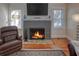 Close-up of the brick fireplace in the living room, showcasing its unique design at 165 21St Ne Ave, St Petersburg, FL 33704