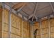 Close-up view of interior garage framing, showcasing construction details with wooden beams and metal brackets at 165 21St Ne Ave, St Petersburg, FL 33704
