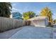 View of the detached two-car garage with a brick driveway and fenced backyard at 165 21St Ne Ave, St Petersburg, FL 33704