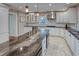 Modern kitchen with granite countertops, custom cabinets, stainless steel appliances, and tile floors at 165 21St Ne Ave, St Petersburg, FL 33704