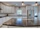 Modern kitchen with granite island and stainless steel appliances at 165 21St Ne Ave, St Petersburg, FL 33704
