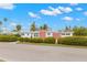 Front view of a mid-century modern home with a landscaped yard at 204 163Rd Ave, Redington Beach, FL 33708