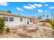 Front view of a mid-century modern home with a small yard at 204 163Rd Ave, Redington Beach, FL 33708