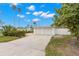 Two-car garage with white doors and a driveway at 204 163Rd Ave, Redington Beach, FL 33708