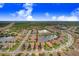 Aerial view of a house and neighborhood with lake at 2756 Tarragona Way, Wesley Chapel, FL 33543