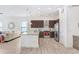 Modern kitchen with island and stainless steel appliances at 2756 Tarragona Way, Wesley Chapel, FL 33543