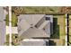Two story home, aerial view of roof and backyard at 33157 Rosewood Bark Way, Wesley Chapel, FL 33545