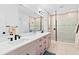 Elegant bathroom with double vanity, large shower, and modern fixtures at 33157 Rosewood Bark Way, Wesley Chapel, FL 33545