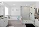 Spa-like bathroom with soaking tub and walk-in shower at 33157 Rosewood Bark Way, Wesley Chapel, FL 33545