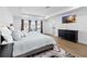 Main bedroom with large bed and plenty of natural light at 33157 Rosewood Bark Way, Wesley Chapel, FL 33545