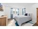 Bright bedroom with comfortable bed and plenty of natural light at 33157 Rosewood Bark Way, Wesley Chapel, FL 33545