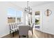 Breakfast nook with striped bench seating and view of backyard at 33157 Rosewood Bark Way, Wesley Chapel, FL 33545