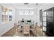 Bright dining room with a round table and six chairs at 33157 Rosewood Bark Way, Wesley Chapel, FL 33545