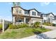 Two-story home with a neutral color palette and landscaping at 33157 Rosewood Bark Way, Wesley Chapel, FL 33545