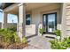Inviting front door entrance with welcoming porch at 33157 Rosewood Bark Way, Wesley Chapel, FL 33545