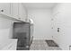 Convenient laundry room with washer, dryer, and storage at 33157 Rosewood Bark Way, Wesley Chapel, FL 33545