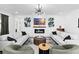 Spacious living room with modern fireplace and ample seating at 33157 Rosewood Bark Way, Wesley Chapel, FL 33545