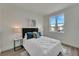 Bright bedroom with a queen bed and large window at 3442 Desert Trunk Ct, Tampa, FL 33614