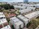 Aerial view showcasing modern townhomes, surrounding cityscape, and waterfront views at 4910 W Mcelroy Ave # 5, Tampa, FL 33611