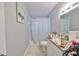 Clean bathroom with shower/tub combo and granite vanity at 5117 12Th S Ave, Gulfport, FL 33707
