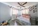 Bright bedroom with double bed and large windows at 5117 12Th S Ave, Gulfport, FL 33707