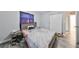 Bedroom with bed, gray walls, and wood floors at 5117 12Th S Ave, Gulfport, FL 33707