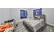 Bedroom with bed, gray walls, and wood floors at 5117 12Th S Ave, Gulfport, FL 33707