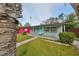 House exterior, gray with teal door and small yard at 5117 12Th S Ave, Gulfport, FL 33707
