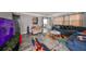 Living room with blue couch, TV, and area rug at 5117 12Th S Ave, Gulfport, FL 33707