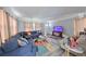 Living room with blue couch and gray walls at 5117 12Th S Ave, Gulfport, FL 33707