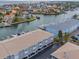 Aerial view of building, parking and canal at 521 Pinellas Bayway S # 107, St Petersburg, FL 33715