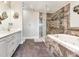 Elegant bathroom with soaking tub and walk-in shower at 521 Pinellas Bayway S # 107, St Petersburg, FL 33715