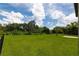 Large grassy backyard with a black metal fence at 5308 105Th E Ter, Parrish, FL 34219