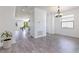 Light-filled dining room with wood floors and chandelier at 5308 105Th E Ter, Parrish, FL 34219