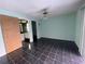Bright bedroom featuring tile flooring and an ensuite bathroom at 5404 Glover Dr, Weeki Wachee, FL 34607