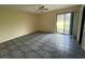 Bedroom with tile floors and sliding glass doors at 5404 Glover Dr, Weeki Wachee, FL 34607