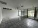 Large bedroom with tile floors and mirrored wall at 5404 Glover Dr, Weeki Wachee, FL 34607